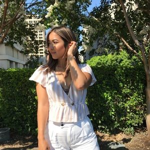 Stripped peplum button top